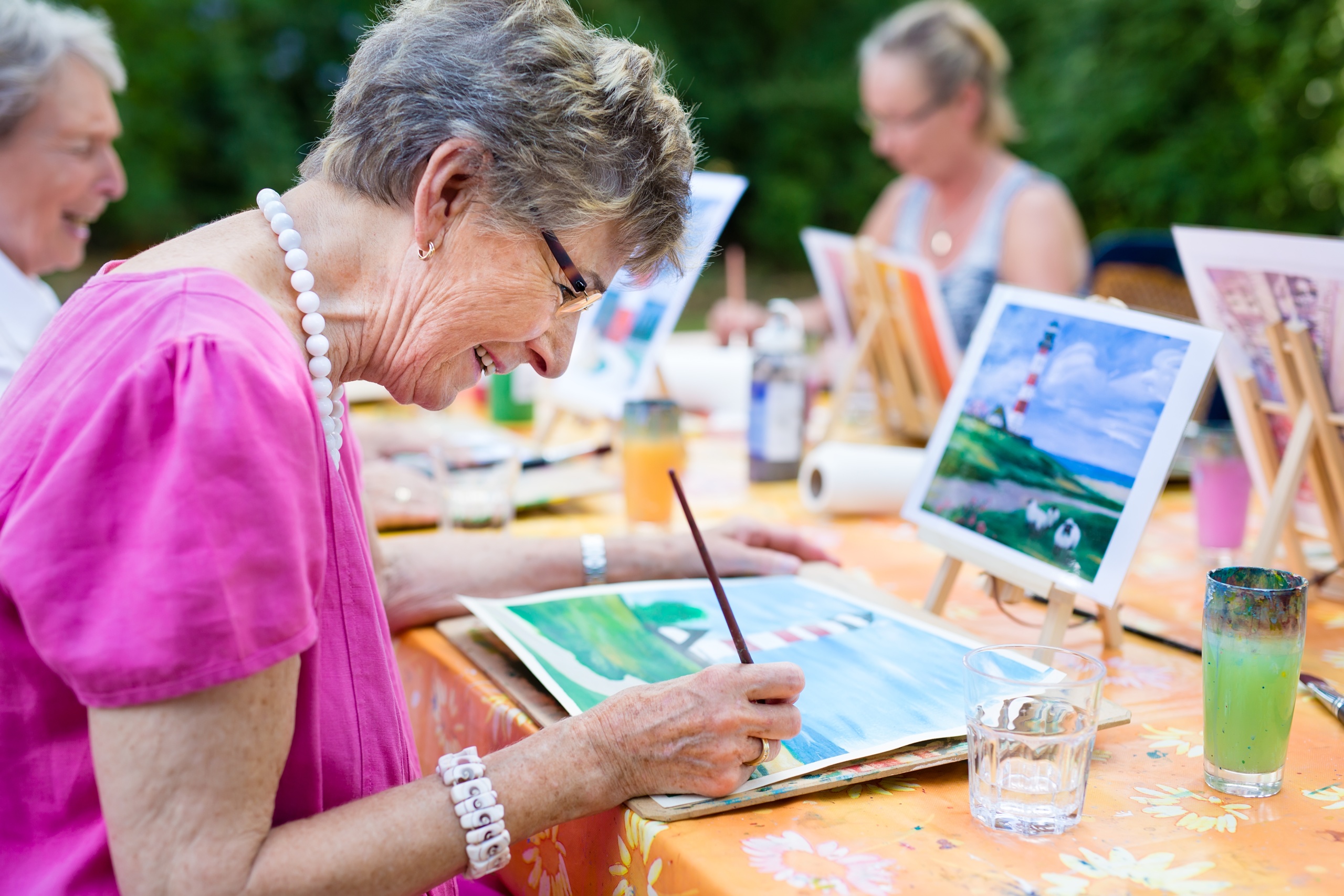 senior woman participating in painting hobby